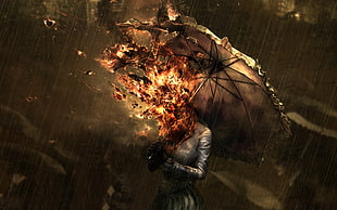 woman holding burning umbrella under the rain
