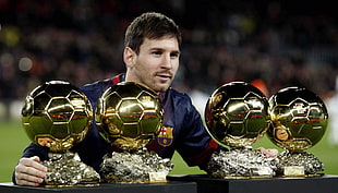 four gold soccer trophies, Lionel Messi, soccer, sports, athletes