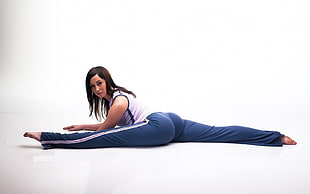woman in blue and white track pants