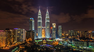Petronas Twin Towers during nighttime HD wallpaper