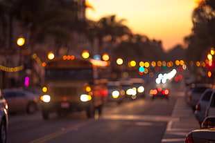 bokeh photography of cars on road