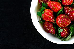 strawberries and white ceramic bowl