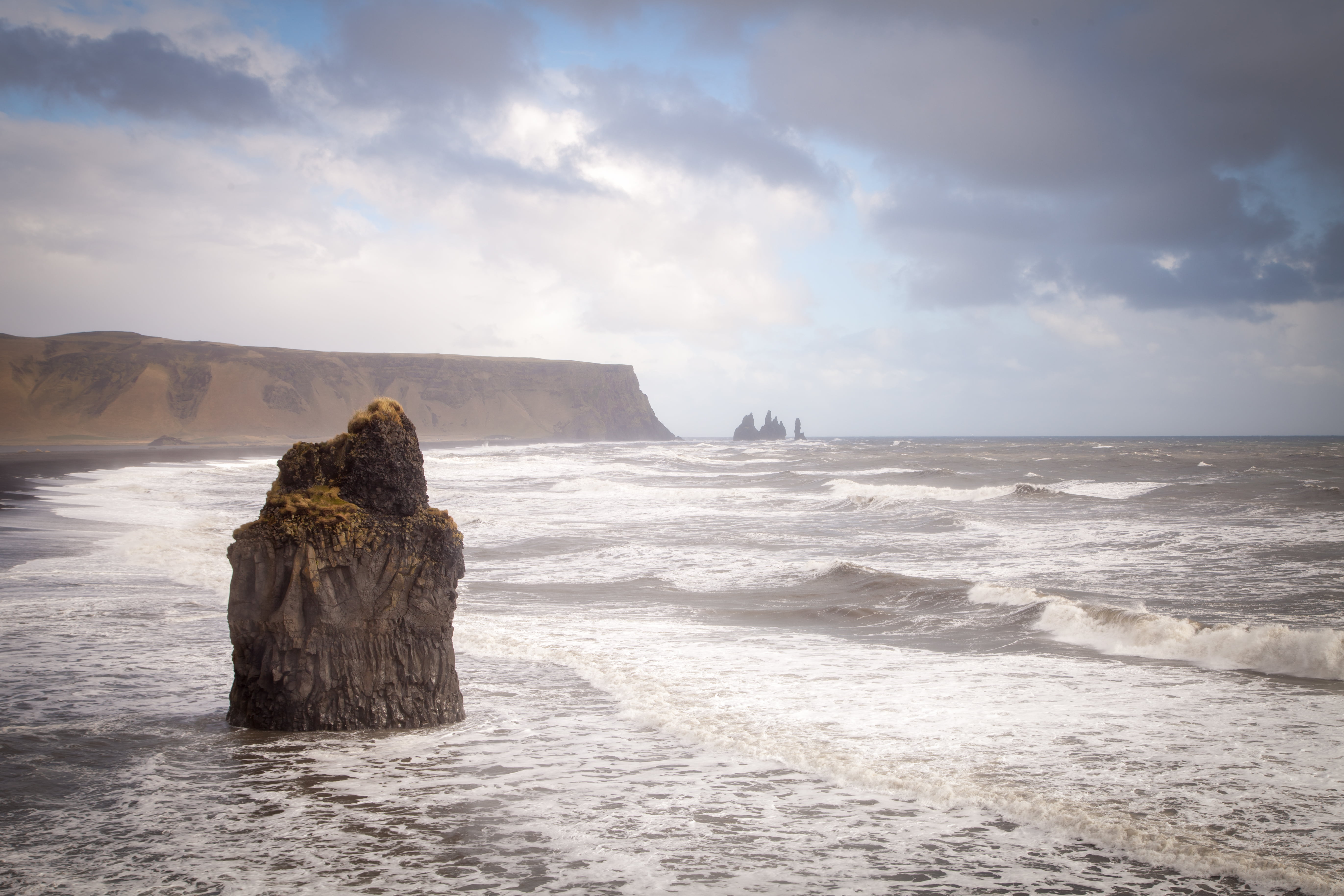 rock monolith on sea water