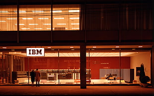 two person standing in front of IBM building HD wallpaper