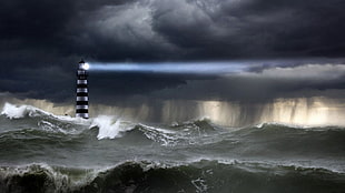 landscape photography of lighthouse in the middle of a stormy sea HD wallpaper