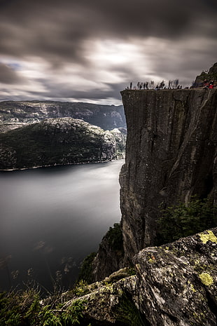 group taking photo near cliff at cloudy day, preikestolen, norway HD wallpaper