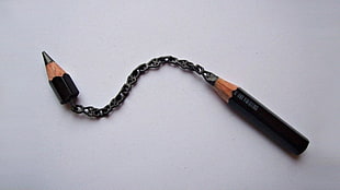 black pencil with chain