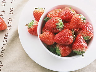 photo of strawberries in white ceramic bowl
