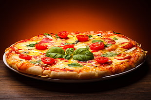 pizza with olives and tomatoes