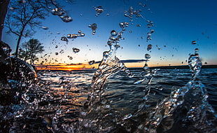 splash of water in the body of water photo HD wallpaper