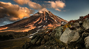 landscape photography of brown cone shape mountain covered with white clouds during daytime, koryaksky, kamchatka