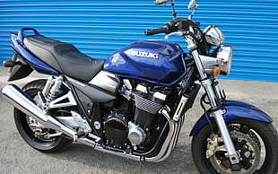 blue Suzuki cruiser motorcycle