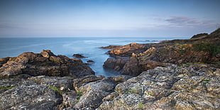 rock formation near sea shore HD wallpaper