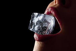 ice cube on person's mouth