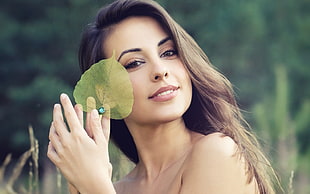woman holding with green leaf photo