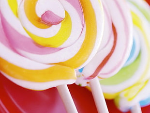 close view of two swirled lollipops