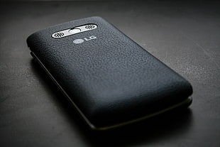 black LG android smartphone above black surface