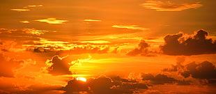 aerial photography white cloudy sky under yellow sunset