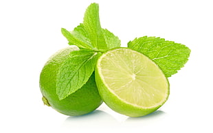 sliced lemon with peppermint leaves closeup photo