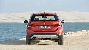 red BMW X-series vehicle, BMW X1, car
