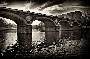 grayscale photo of concrete bridge, po river