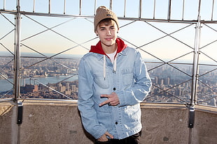 Justin Bieber photo wearing blue denim button-up jacket and brown knit cap