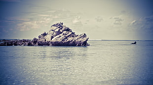 rock formation in body of water
