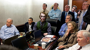 The Joker surrounded by people in room