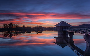 house on dock, sunset