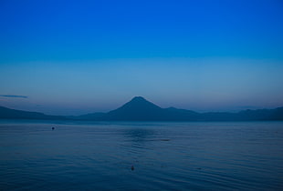 landscape photography of volcano under calm sky