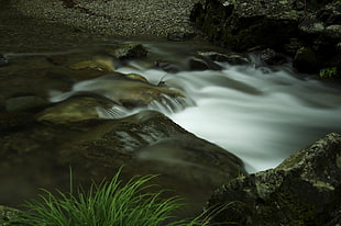 close up photography of river surrounded by rocks HD wallpaper
