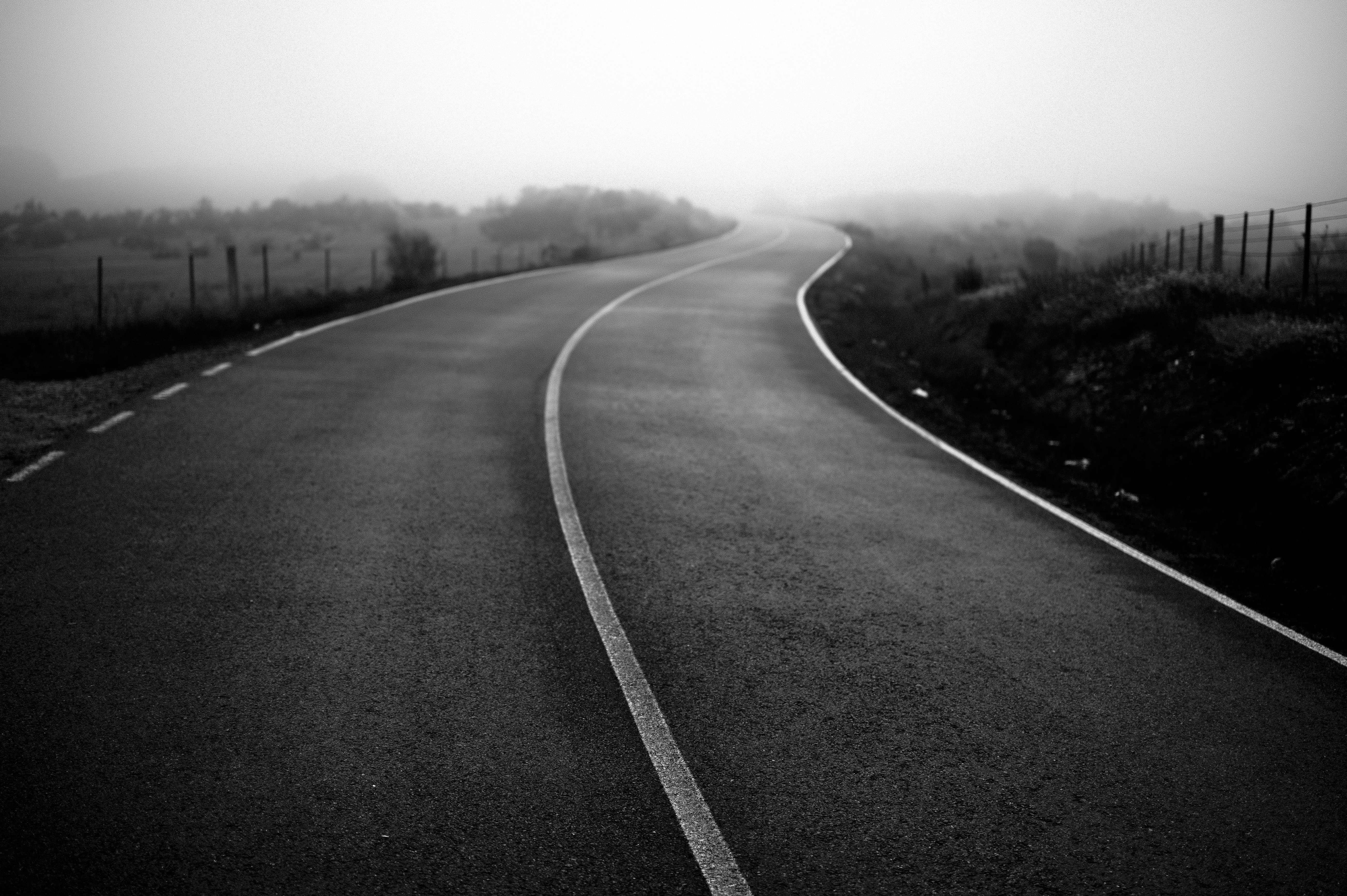 concrete road grayscale photo