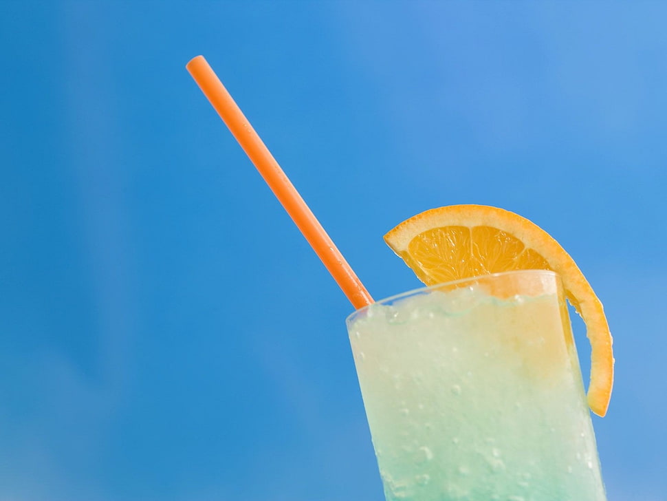 glass with orange slice and red straw HD wallpaper