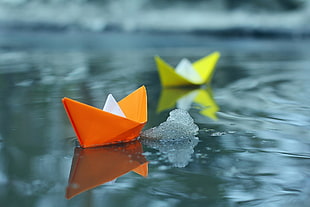 two red and yellow paper boats, paper boats