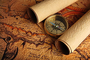 round brown wooden framed mirror, Arrow, compass, map