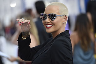 woman in black long-sleeved top wearing sunglasses