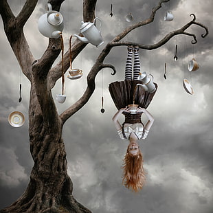 surreal painting of woman hanging upside down on tree with hanging tea ware