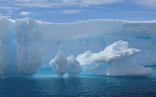photography of iceberg surrounded by bodies of water