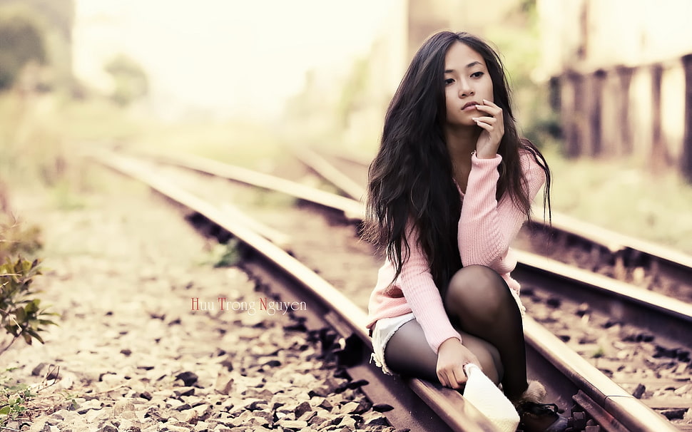 woman sitting on train's rail HD wallpaper