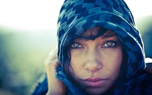 woman covered with gray hood