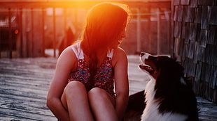 woman wearing multicolored floral tank top beside rough collie during sunset HD wallpaper
