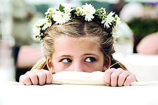 girl wearing white floral headdress