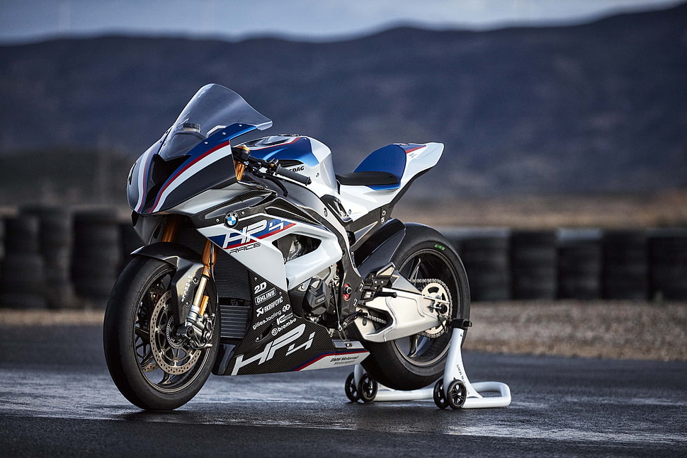 depth of field photography of white and blue HP4 sport bike HD wallpaper