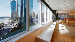 white and brown wooden display cabinet, window, cityscape, interior