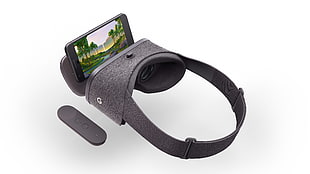 grey and black virtual reality headset installed with smartphone