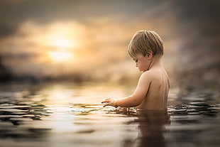 calm body of water, little boy, children, people, water