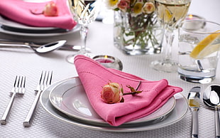 pink rose over pink handkerchief on table top photo HD wallpaper