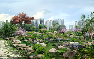 view of garden side area near high rise buildings