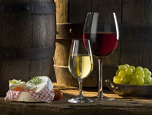 two wine glasses, food, wine, cheese, grapes