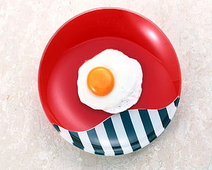 round red and white plate with boiled egg